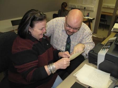 Evelyn works with archivist Richard McKenzie.