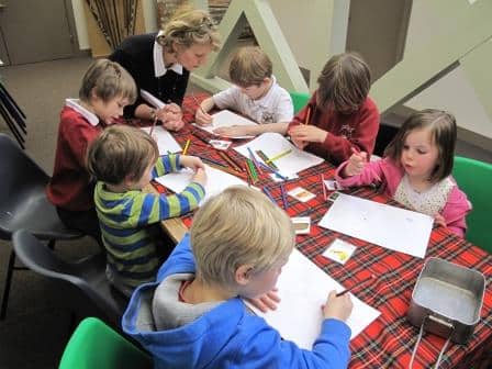 Emily helps a class of nursery children from Murthly Primary School design their own rations for a First World War soldier.