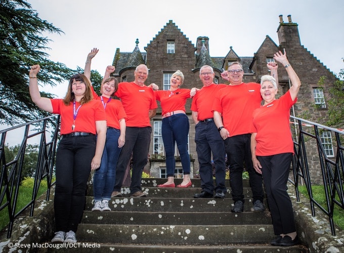 Team members from the Black Watch castle and Museum on the steps outside Balhousie Castle.