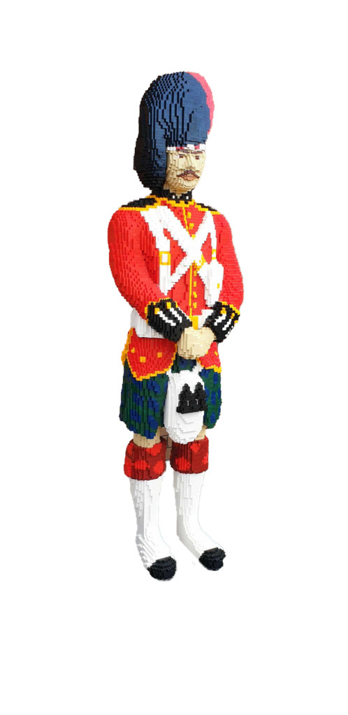 life sized model of a black watch guardsman made from small toy bricks