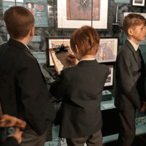Children trying on Black Watch uniforms