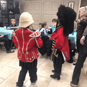 Children trying on Black Watch uniforms