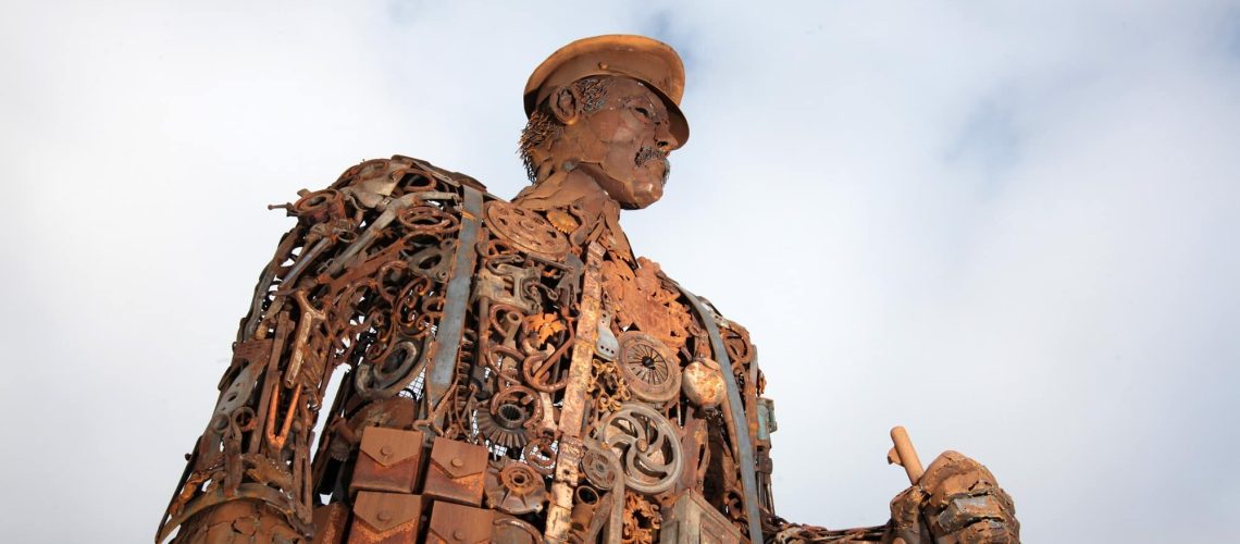 photograph of a sculpture - world war one battle weary soldier 6.5 meters in height made from scrap metal